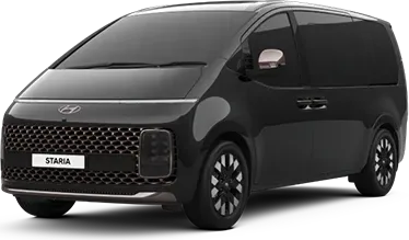 Black Hyundai Staria minivan seen from the front three-quarter angle